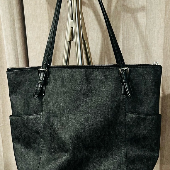 Michael Kors Handbags - Michael Kors Black Tote Bag with MK logo throughout bag.